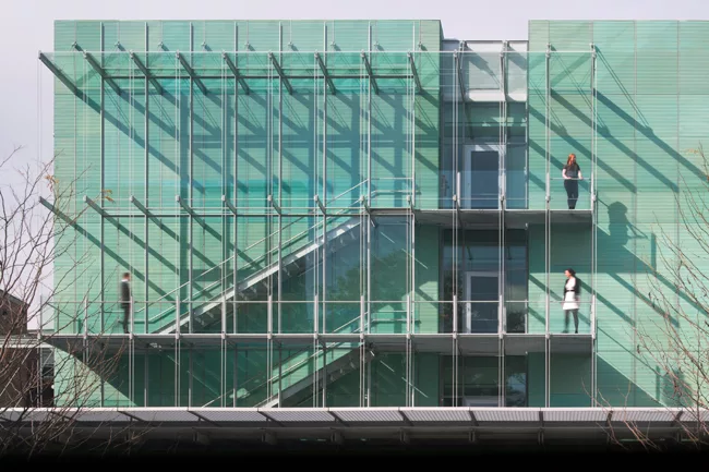 Pre-patinated copper cladding wraps much of the new building.