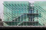 Pre-patinated copper cladding wraps much of the new building.