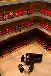 Narrow balconies wrapping the performance space afford views of musicians below as well as other concertgoers.
