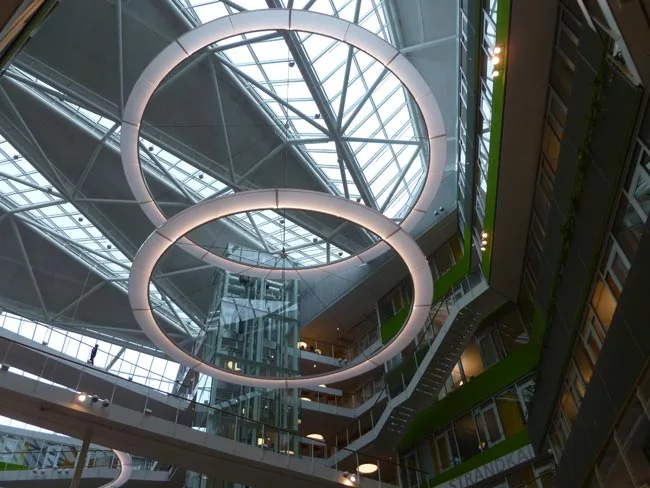 The atrium of Unilever Headquarters features large cirular LED rings. The building has received multiple awards, including Wold's Best Office Building at the 2009 World Architecture Awards.
