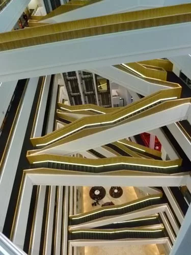 Bridges and stairways cross through the atrium to connect different portions of the office complex.