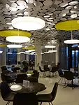 Stuttgart-based designers Peter Ippolito and Gunter Fleitz won the bid for the ground floor cafeteria, which features 4,300 aluminum discs on the ceiling.