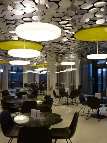 Stuttgart-based designers Peter Ippolito and Gunter Fleitz won the bid for the ground floor cafeteria, which features 4,300 aluminum discs on the ceiling.