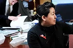 Amy Sadao views a proposal.