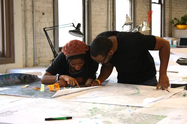 Students work with the Regional UDAT team members on the Pratt City disaster response project in Alabama after tornadoes devastated the neighborhood.