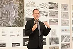 Michael Bell of Michael Bell, Eunjeong Seong: Visible Weather presents at the <em>Foreclosed: Rehousing the American Dream Open Studios</em> at MoMA affiliate P.S.1 in 2011. 