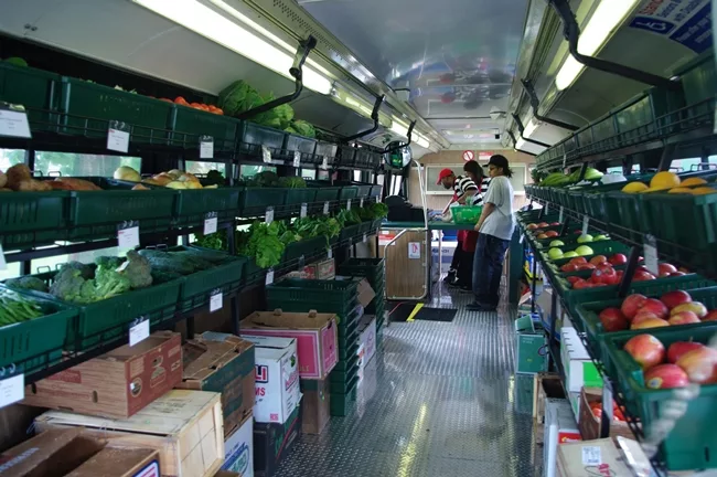 <em>Fresh Moves Mobile Market</em> is a one-aisle grocery store built in a  retrofitted Chicago Transit Authority bus purchased for $1. Architecture  for Humanity partnered with the Chicago nonprofit 