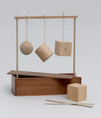 <em>Froebel Gift No. 2: Sphere, Cylinder, and Cube</em>, c. 1890