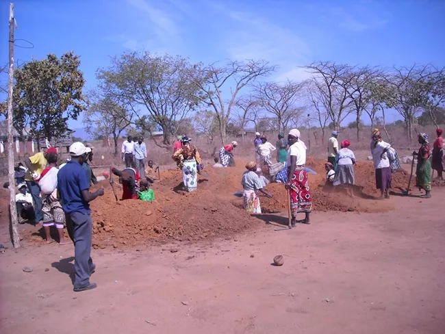 <p>In July 2009, Newman and his team from Engineers Without Borders NYC oversaw the design and construction of a small library for the community of Usalama in rural Kenya.  Here, the community wo