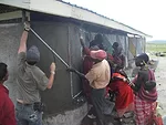 <p><strong>Loita Learning Center</strong></p><p>Over 70,000 bottle caps were collected throughout the U.S. and Africa and became the siding for the building as well as a monument to the Maasai culture