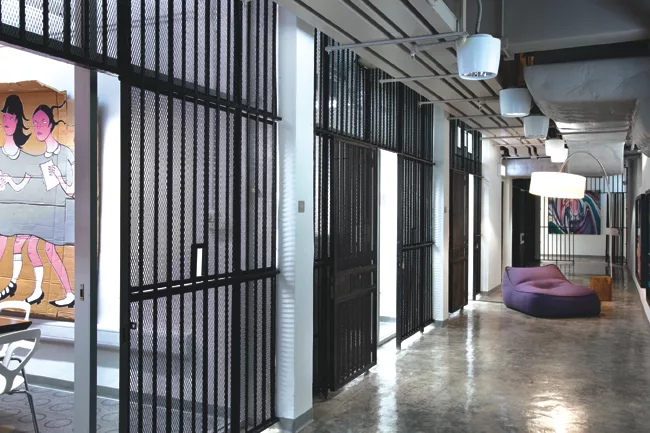 The justice building's original jail cells were preserved and now function as classrooms, studio space, and offices.