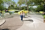 Children explore <em>Convex/Concave</em>, an outdoor sculpture by Dan Graham at the Jardín Botánico de Culiacán.