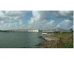 The Maeslantkering surge gates protect Rotterdam, in the Netherlands, the world’s third busiest port in terms of cargo tonnage. Construction was completed in 1997 and cost $450 million. The barr