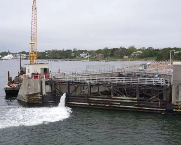 The New Bedford Hurricane Barrier protects New Bedford, Massachusetts. It was built to protect 1,400 acres of highly developed industrial and commercial property. The barrier was completed in 1966,
