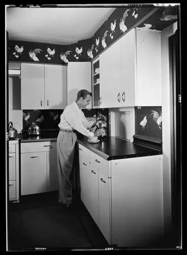 Actor Alan Ladd in his kitchen, Holmby Hills, Los Angeles, c. 1949