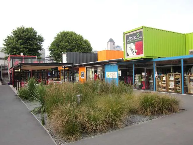 Re:START is a temporary shopping center and public space in Christchurch, built of brightly colored, artfully arrayed shipping containers.