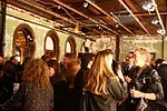 Event guests in a former office space at 5 Beekman Street.