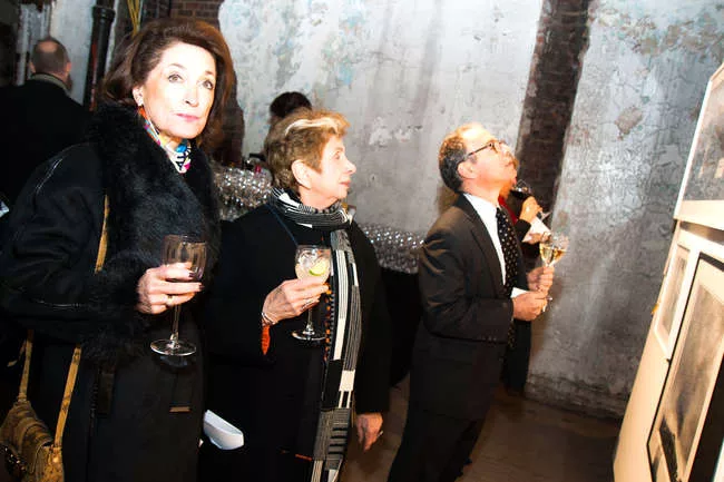 Event guests browse work in the benefit's silent auction.