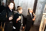 Event guests browse work in the benefit's silent auction.