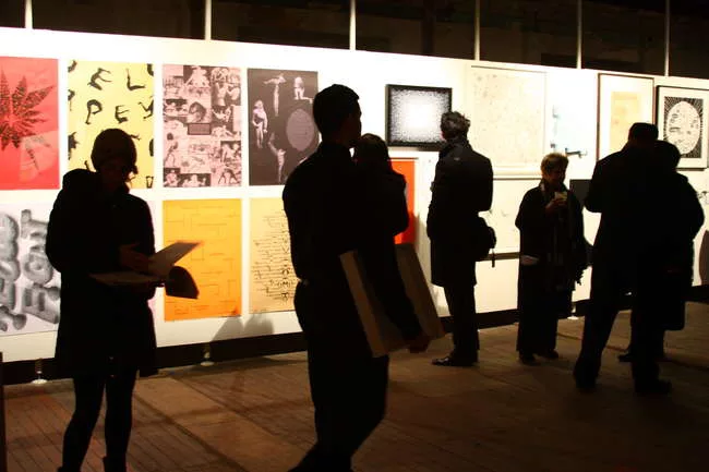Event guests browse work in the benefit's silent auction.