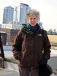 Director Su Friedrich in front of condominium towers on the Williamsburg waterfront.<br />