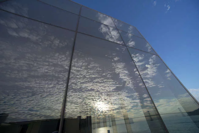 Clouds reflecting on the glass walls of the Exploratorium’s new Bay Observatory Gallery. <br />