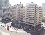 A neighborhood of unlovable 1970s concrete buildings—built shortly after the discovery of oil—surrounds the exhibition spaces.