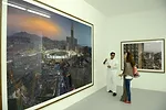 On the ground floor, photographs and an installation by Saudi artist Ahmed Mater critique the excesses on overdevelopment around the Masjid al-Haram in Mecca. Shown in monumental prints with an overpo