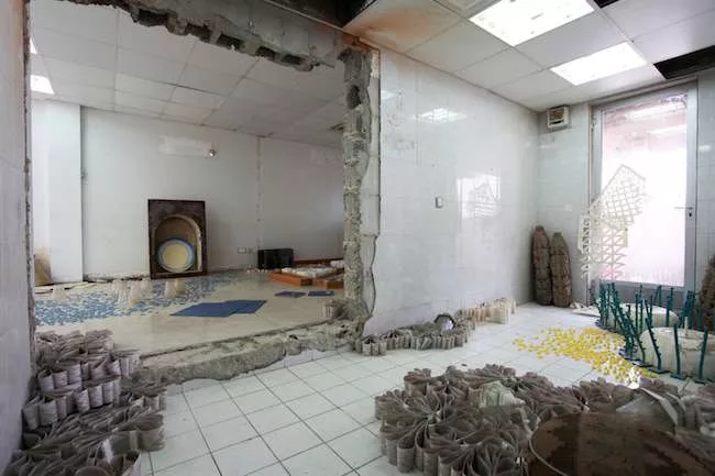 An installation titled <em>The Garden from Free Zone,</em> 2013, by Sara Ramo provides a memento mori on the top floor of the Sharjah Islamic Bank building. The Madrid-based artist created a landscape