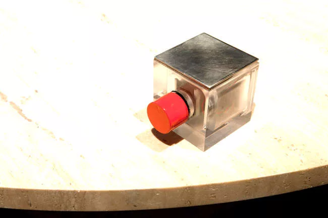 A detail of the remote control on the round table from the Tools for Life collection from Knoll.