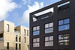Fusi &amp; Ammann designed Case Study #1 Hamburg (right) as a  cost-effective modern home with guaranteed access to gardens and roof terraces.  Prefabricated elements such as pre-stressed concrete cei