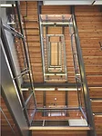 With the goal of making the stairs a more attractive option than the elevator, the design team created an “irresistible stair” with wood treads and glass balustrades.