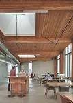 The building’s four upper levels have a heavy-timber structure of Douglas fir, with components such as laminated beams and wood-deck ceilings left largely exposed.