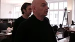 Still from <em>The Competition</em>: Jean Nouvel critiques his project team's design for a museum in Andorra.