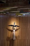 A 1953 sculpture made from carved teak by Danish artist Henrik Starcke hangs prominently in the chamber.