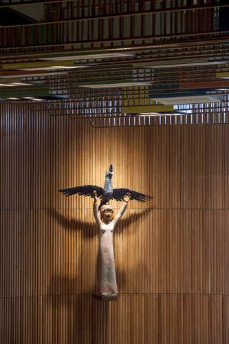 A 1953 sculpture made from carved teak by Danish artist Henrik Starcke hangs prominently in the chamber.