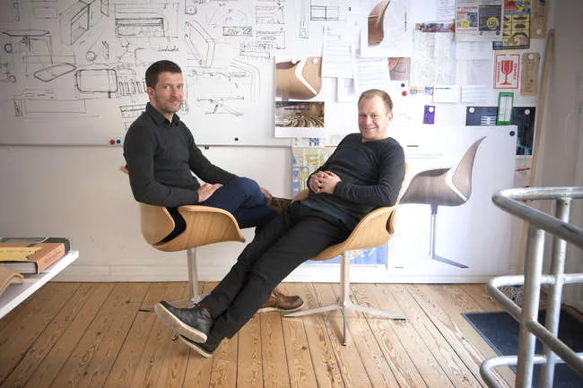 Kasper Salto and Thomas Sigsgaard sitting in their <em>Council Chair</em> (2013).