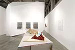 Eric Owen Moss' unrealized <em>Fun House</em> (1980), as it appears in a vintage model, plays semi-severed sculptural forms against a graphic wrap. On the wall, Morphosis' <em>Sixth Street House</em> 
