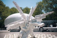 At the Ideas City street fair: An installation made from discarded styrofoam by Terreform ONE rises in front of Raumlabor's <em>Spacebuster</em>, a mobile inflatable pavilion comissioned by the Storef