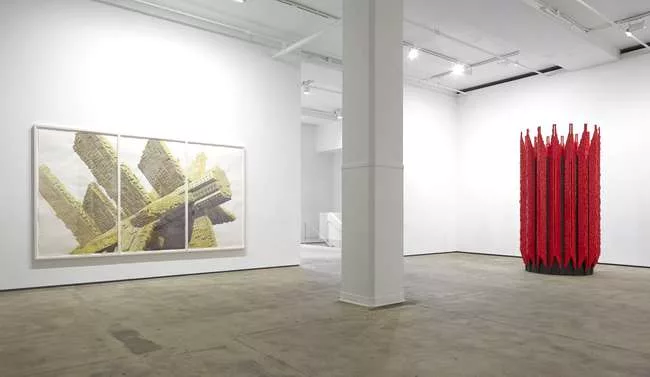Installation view of the Los Carpinteros exhibition, <em>Irreversible,</em> at Sean Kelly Gallery<br /> Left: <em>Knin Lego (Triptico)</em>, 2012<br />Right: <em>Robotica</em>, 2013