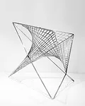 <strong>At ICFF</strong><br /> Los Angeles architect Carlo Aiello’s 'Parabola Chair.' Though it’s geometry curves in two directions, all of the chair’s components are straight and si