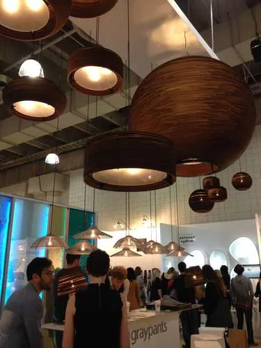 <strong>At ICFF</strong><br /> Cardboard light fixtures at the Graypants Studio booth.