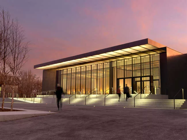 The north façade of the new East Building at dusk.