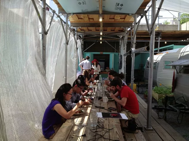 Students and guests have lunch following the mid-residency critique.