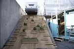 A trailer perched on the second floor of the the Colony's scaffolding structure.