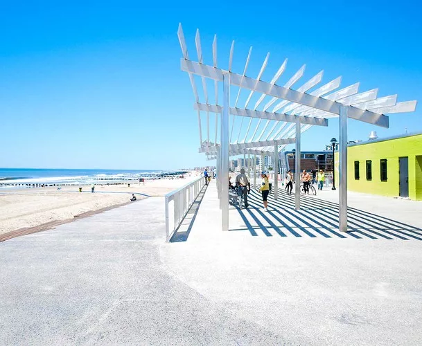 Sage and Coombe Architects’ trellised canopies perch in front of restored concession stands in Queens, N.Y.