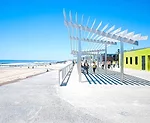 Sage and Coombe Architects’ trellised canopies perch in front of restored concession stands in Queens, N.Y.