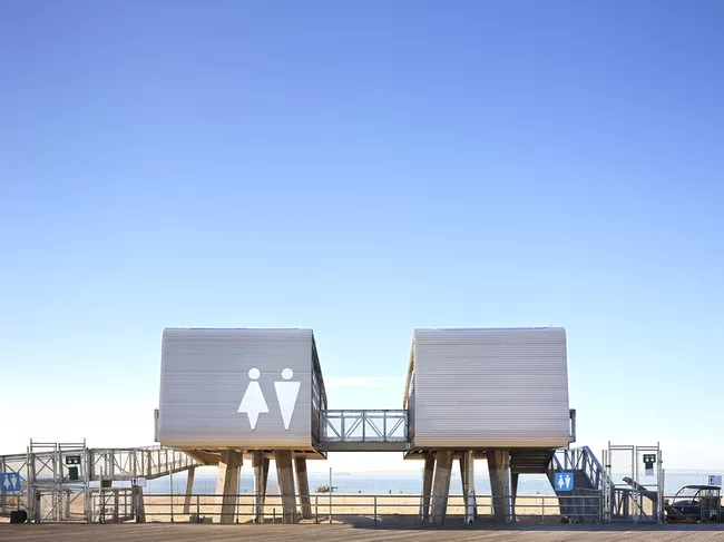 A Coney Island comfort station by Garrison Architects is one of 35 permanent steel-framed modular structures that have been deployed in Queens, Brooklyn, and Staten Island.