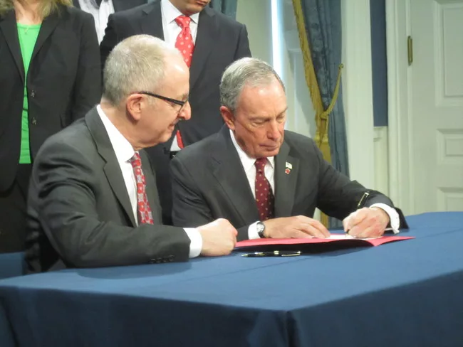 Mayor Bloomberg and Cornell president David Skorton (left) sign a 99-year agreement to bring a high-tech campus to NYC.