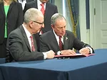 Mayor Bloomberg and Cornell president David Skorton (left) sign a 99-year agreement to bring a high-tech campus to NYC.